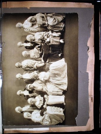 Photograph, all in Colonial dress. Loose Inside Cover